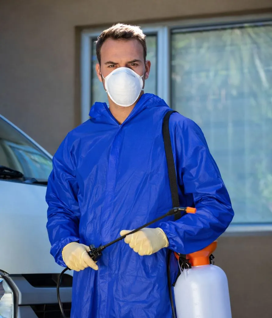 Certified pest control specialist performing a professional treatment in a Los Angeles property.